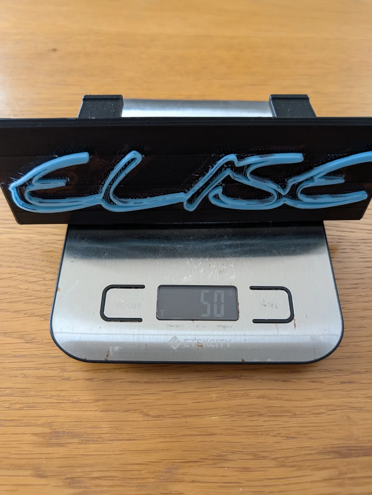 The finished 3D printed face plate on the scales